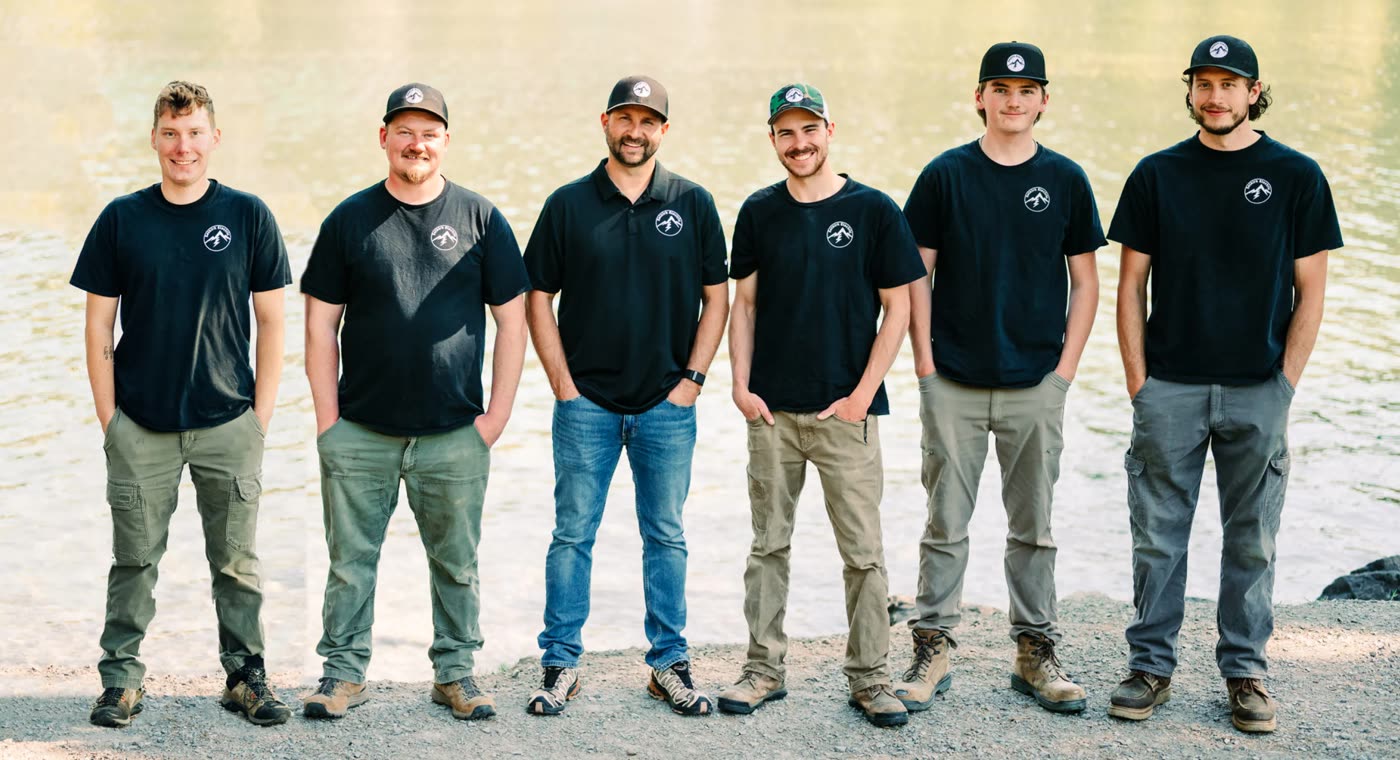 The Selkirk Electric & Integration crew standing together in Selkirk shirts